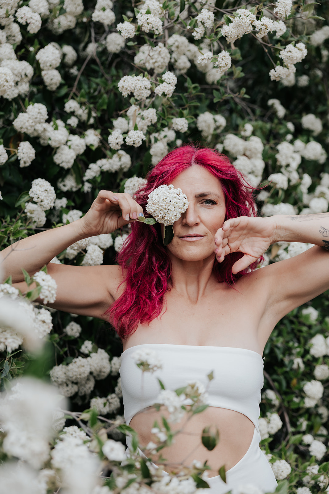 Empowerment Photoshoot in front of spring flowers