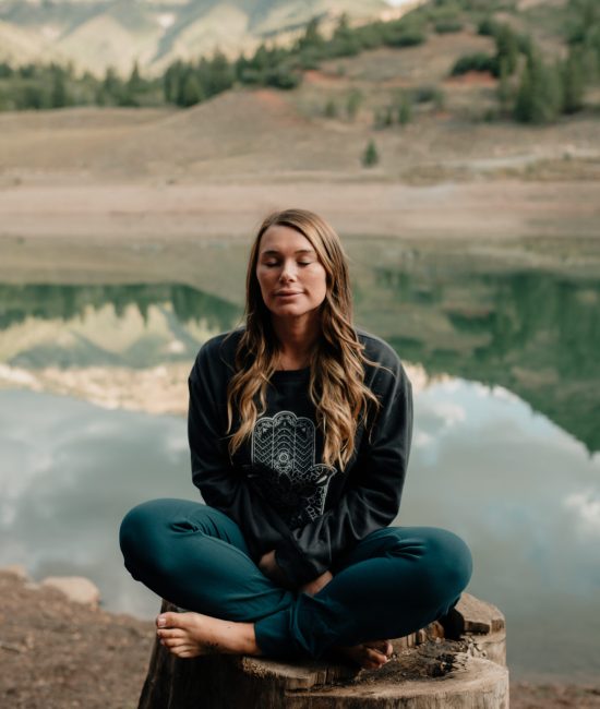 a woman sitting in meditation